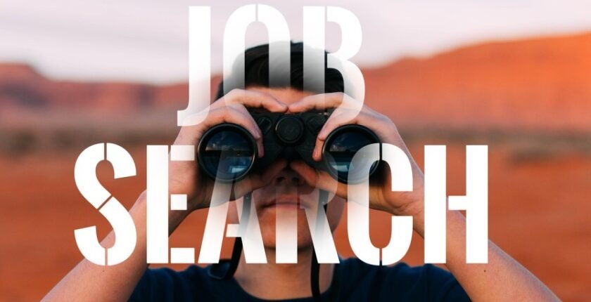 Person holding binoculars peering for Dream Job opportunity